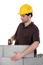 Builder with a block wall