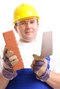 Builder with brick and trowel Royalty Free Stock Photo