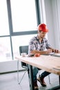 Builder is calculating the cost of materials Royalty Free Stock Photo