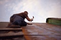 Builder or carpenter working on the roof Royalty Free Stock Photo