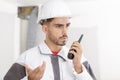 builder chatting on walkie talkie Royalty Free Stock Photo