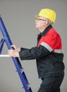 Builder climbing on a ladder