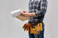 Builder with clipboard, pencil and working tools Royalty Free Stock Photo