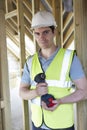 Builder On Construction Site Holding Cordless Drill Royalty Free Stock Photo