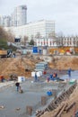 Builder on construction site wearing helmet uniform works