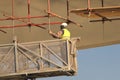 Worker at the construction site work on scaffolding Royalty Free Stock Photo