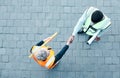 Builder, construction worker and architect handshake with aerial view of teamwork, labor collaboration and industrial Royalty Free Stock Photo