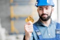 Builder with cryptocoin Royalty Free Stock Photo