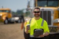 Builder with cup of coffee. Construction engineer worker in builder uniform near construction building. Portrait of Royalty Free Stock Photo