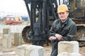 Builder in dirty workwear at construction site Royalty Free Stock Photo