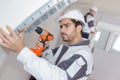 builder drilling into wall Royalty Free Stock Photo