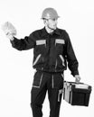 Builder earn money, repairman holds banknotes in hand. Payday concept. Man with toolbox got salary, money for work. Royalty Free Stock Photo