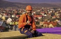 Builder enjoy success. Construction Industry and Waterproofing. roofer working on roof structure of building on Royalty Free Stock Photo