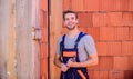 Builder enjoy success. worker brick wall background. building and construction. man builder in work clothes Royalty Free Stock Photo