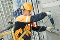 Builder at facade construction work Royalty Free Stock Photo
