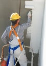 Builder facade painter at work Royalty Free Stock Photo