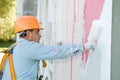 Builder facade painter at work Royalty Free Stock Photo