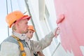 Builder facade painters at work Royalty Free Stock Photo