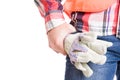 Builder hand holding construction gloves