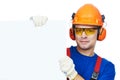 Builder in hard hat, earmuffs and goggles Royalty Free Stock Photo