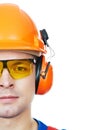 Builder in hard hat, earmuffs and goggles Royalty Free Stock Photo