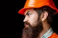 Builder in hard hat, foreman or repairman in helmet. Man builders, industry. Bearded man worker with beard in building Royalty Free Stock Photo