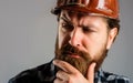 Builder in hard hat, foreman or repairman in helmet. Mechanical worker in hardhat. Closeup portrait.