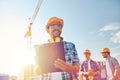 Builder in hardhat with clipboard at construction Royalty Free Stock Photo