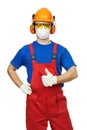 Builder in hardhat, earmuffs, goggles and gas mask Royalty Free Stock Photo