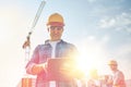 Builder in hardhat with tablet pc at construction Royalty Free Stock Photo