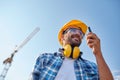 Builder in hardhat with walkie talkie Royalty Free Stock Photo