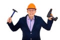 Builder in a helmet with a drill and hammer Royalty Free Stock Photo