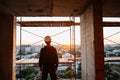 Hard hat builder inside building under construction Royalty Free Stock Photo