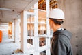 Hard hat builder inside building under construction Royalty Free Stock Photo