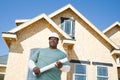 A builder holding a blueprint Royalty Free Stock Photo