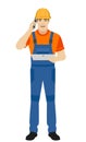 Builder holding digital tablet and talking on the mobile phone