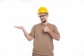 Builder Holding Hand to Side Showing Thumb Up Isolated. Man Construction Worker Sign. Advertisment, Commercial, Business Royalty Free Stock Photo