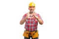Builder holding heart symbol with fingers