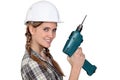 Builder holding a power tool