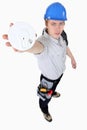 Builder holding smoke alarm