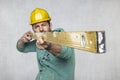 The builder holds in his hands the spirit levels, the idea of accuracy in the construction Royalty Free Stock Photo