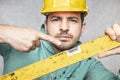 The builder holds in his hands the spirit levels, the idea of accuracy in the construction Royalty Free Stock Photo