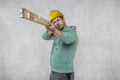 The builder holds in his hands the spirit levels, the idea of accuracy in the construction Royalty Free Stock Photo