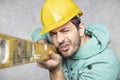 The builder holds in his hands the spirit levels, the idea of accuracy in the construction Royalty Free Stock Photo