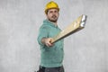 The builder holds in his hands the spirit levels, the idea of accuracy in the construction Royalty Free Stock Photo