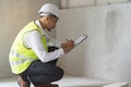 Builder inspection consultancy. Inspector checking material and structure in construction