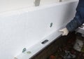 Builder install Styrofoam insulation board. House Wall Polystyrene Insulation.