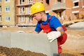 Builder installing road concrete kerb Royalty Free Stock Photo