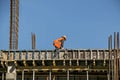 Builder installs formwork and iron reinforcement or reinforcing bar for reinforced concrete partitions Royalty Free Stock Photo