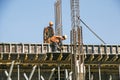 Builder installs formwork and iron reinforcement or reinforcing bar for reinforced concrete partitions Royalty Free Stock Photo